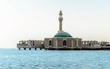 Visit the Floating Mosque. The "Al-Rahmah mosque," also known as the Floating Mosque, is a one-of-a-kind symbol of Jeddah, sitting just above the sea and drawing visitors' eyes in with its bright white color and unmistakable turquoise dome. It's undoubtedly one of the most Instagrammable spots in all of Saudi Arabia.
